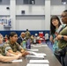 Service members and residents participate in an Emergency Evacuation Program exercise