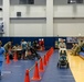 Service members and residents participate in an Emergency Evacuation Program exercise