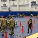 Service members and residents participate in an Emergency Evacuation Program exercise