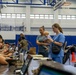 Service members and residents participate in an Emergency Evacuation Program exercise