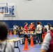 Service members and residents participate in an Emergency Evacuation Program exercise