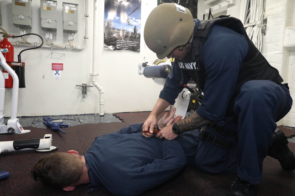 Sailors aboard the USS Rafael Peralta (DDG 115) conduct training before conducting active shooter drills in the South China Sea