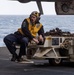 USS Ronald Reagan (CVN 76) Sailors taxi aircraft