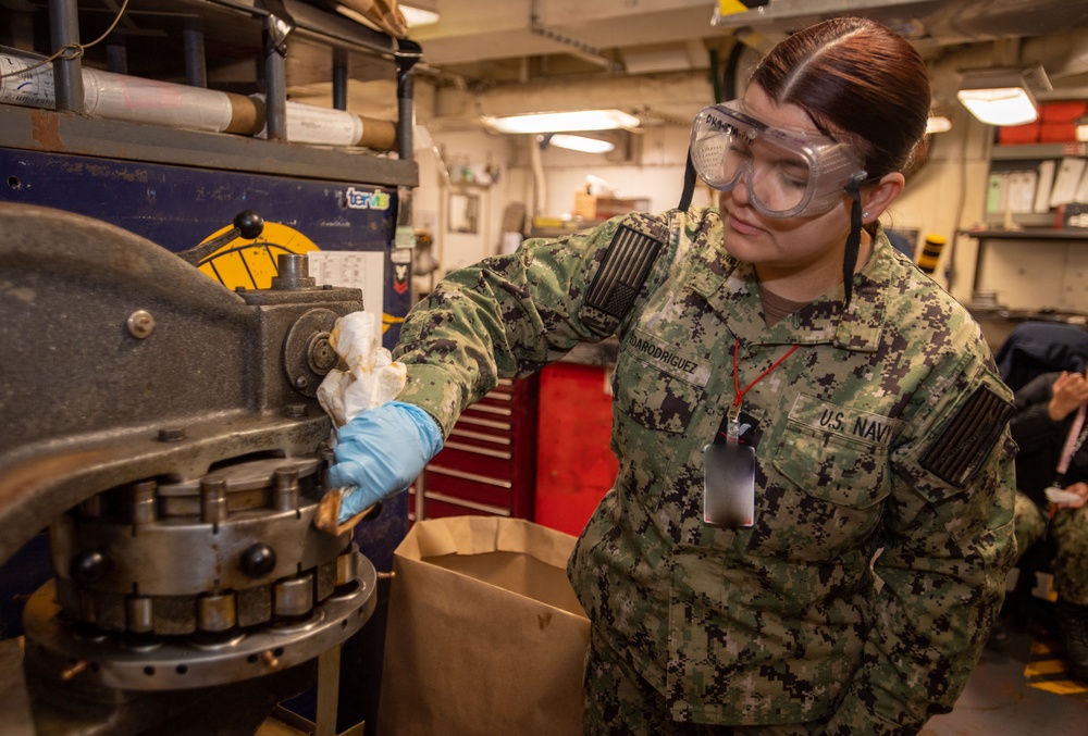 U.S. Navy Sailor Cleans Turret Punch