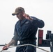 U.S. Navy Sailor Lowers Boat Off Of Ship