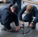 U.S. Navy Sailors Secure Hatch