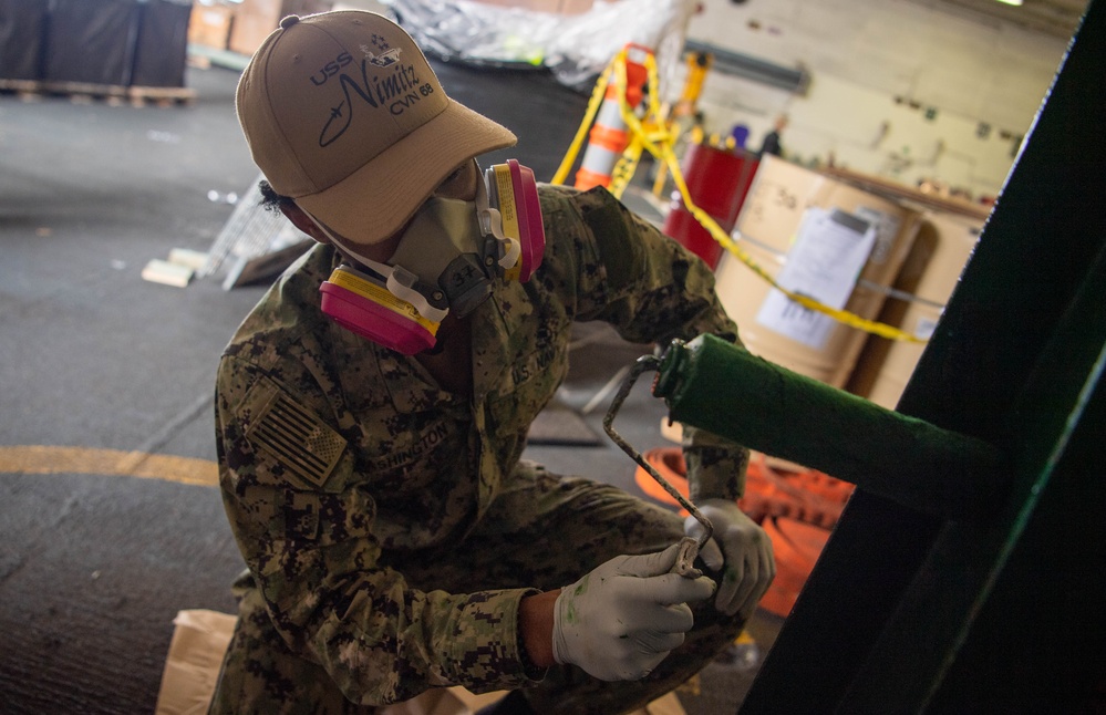 U.S. Navy Sailor Paints Station