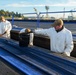 U.S. Navy Sailors Clean Catapult Trough