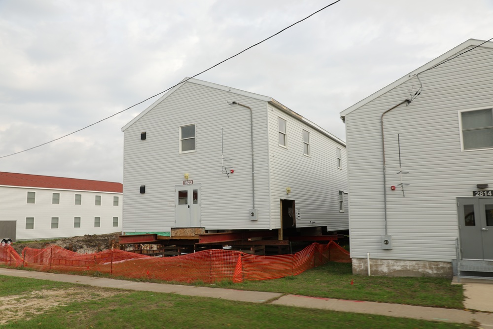 Work to build new foundations for relocated World War II-era barracks continues at Fort McCoy