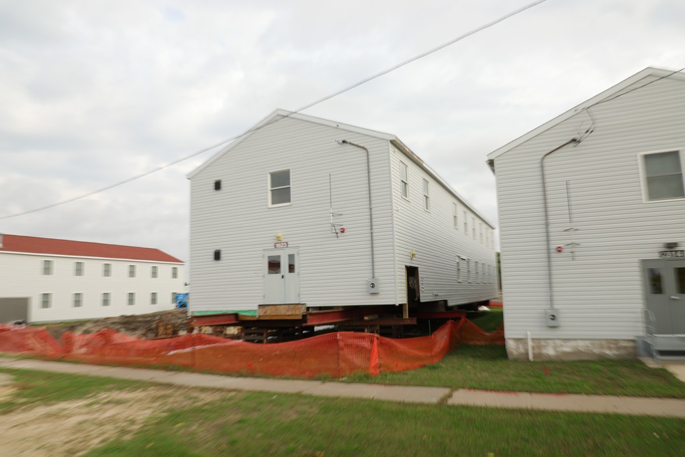 Work to build new foundations for relocated World War II-era barracks continues at Fort McCoy