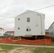 Work to build new foundations for relocated World War II-era barracks continues at Fort McCoy