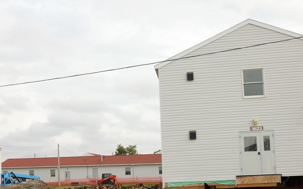 Work to build new foundations for relocated World War II-era barracks continues at Fort McCoy