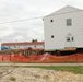 Work to build new foundations for relocated World War II-era barracks continues at Fort McCoy