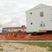 Work to build new foundations for relocated World War II-era barracks continues at Fort McCoy