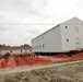 Work to build new foundations for relocated World War II-era barracks continues at Fort McCoy