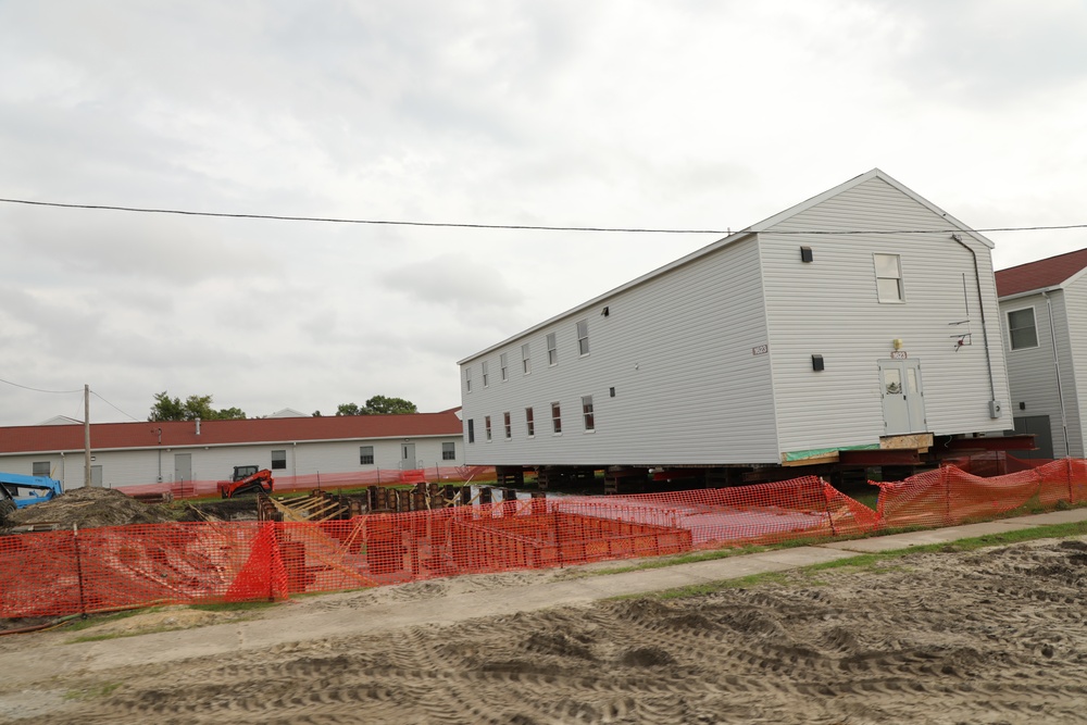 Work to build new foundations for relocated World War II-era barracks continues at Fort McCoy