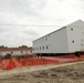 Work to build new foundations for relocated World War II-era barracks continues at Fort McCoy