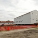 Work to build new foundations for relocated World War II-era barracks continues at Fort McCoy