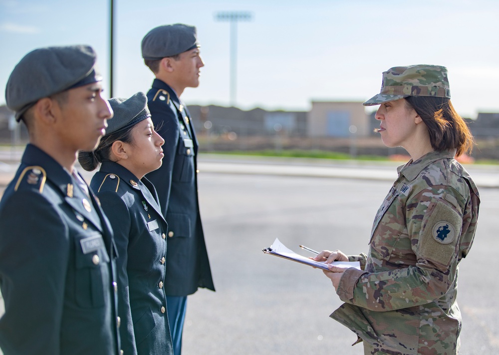 ARSOUTH, 410th CSB, and ARNORTH NCOs support local JROTC during drill competition