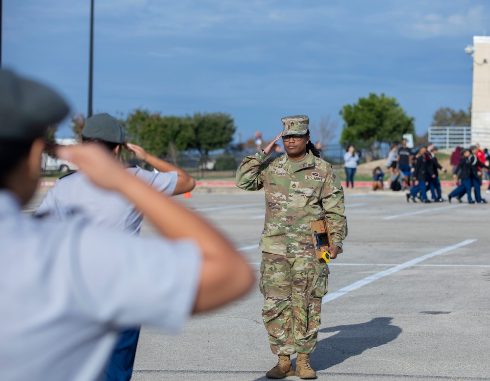 ARSOUTH, 410th CSB, and ARNORTH NCOs support local JROTC during drill competition