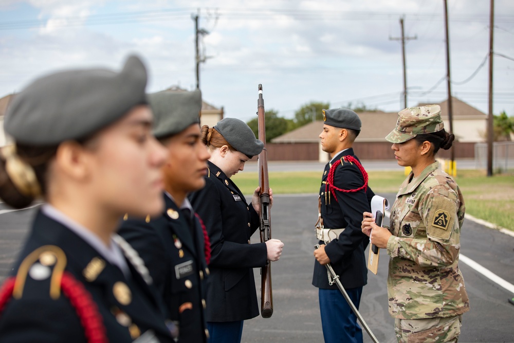 ARSOUTH, 410th CSB, and ARNORTH NCOs support local JROTC during drill competition