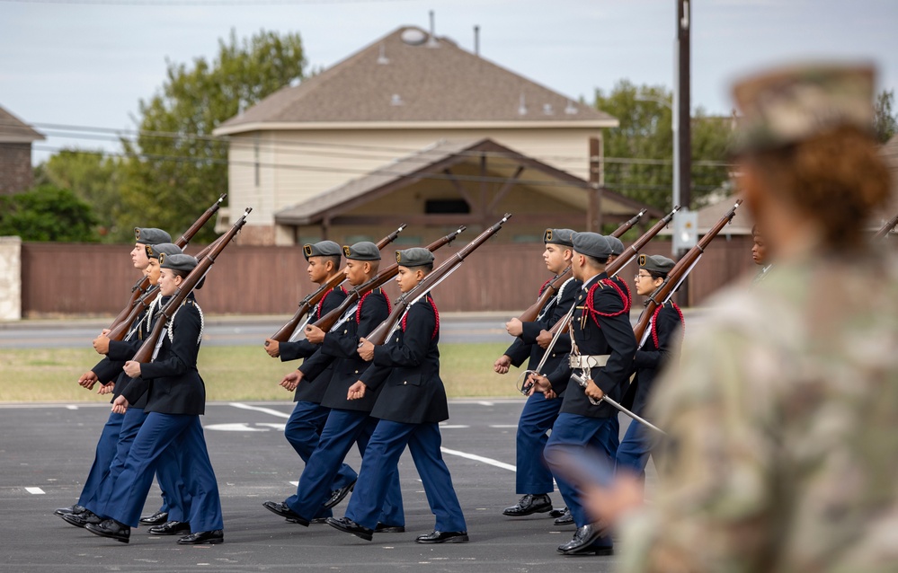 ARSOUTH, 410th CSB, and ARNORTH NCOs support local JROTC during drill competition