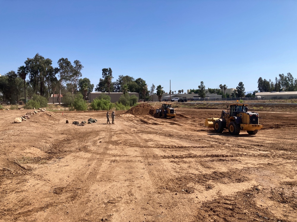Members perform heavy equipment training while maintaining operational awareness and response