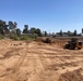 Members perform heavy equipment training while maintaining operational awareness and response