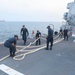 Sailors aboard the USS Rafael Peralta (DDG 115) conduct sea and anchor detail during a scheduled port visit to Singapore