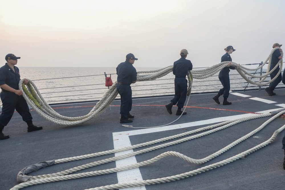 Sailors aboard the USS Rafael Peralta (DDG 115) conduct sea and anchor detail during a scheduled port visit to Singapore