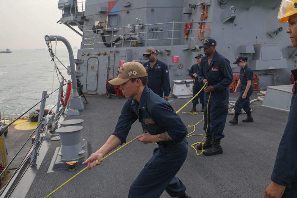 Sailors aboard the USS Rafael Peralta (DDG 115) conduct sea and anchor detail during a scheduled port visit to Singapore