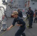 Sailors aboard the USS Rafael Peralta (DDG 115) conduct sea and anchor detail during a scheduled port visit to Singapore