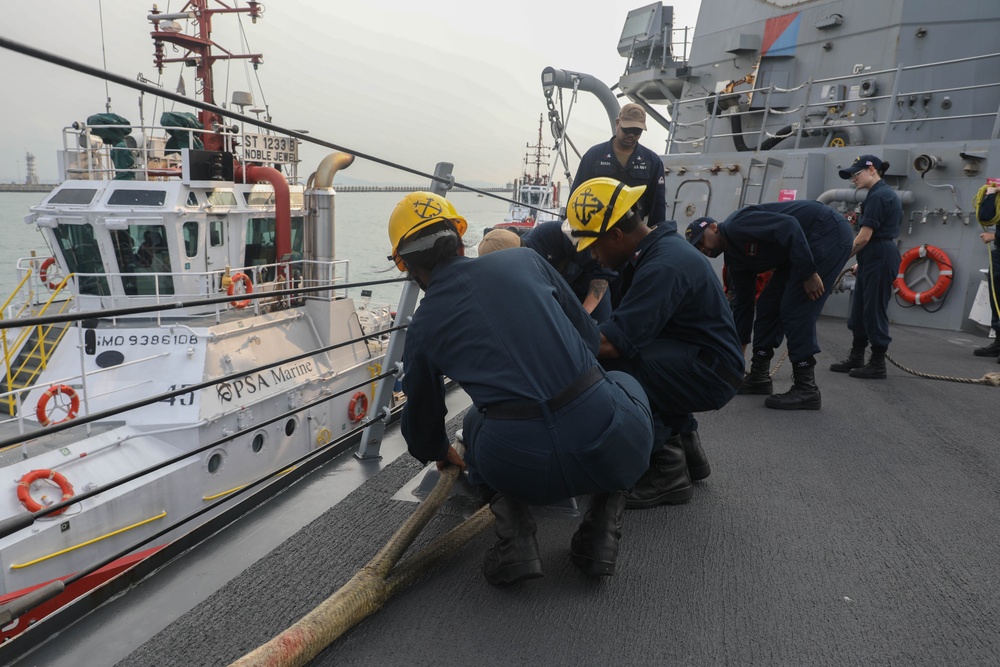 Sailors aboard the USS Rafael Peralta (DDG 115) conduct sea and anchor detail during a scheduled port visit to Singapore