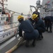 Sailors aboard the USS Rafael Peralta (DDG 115) conduct sea and anchor detail during a scheduled port visit to Singapore