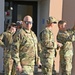 A group of 173rd Fighter Wing Airmen look toward the sun during the solar eclipse using special glasses.