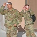 U.S. Air Force Master Sgt. Rudy Mora and Senior Airman Peyton Maurer, 173rd Maintenance Group, peer toward the solar eclipse.