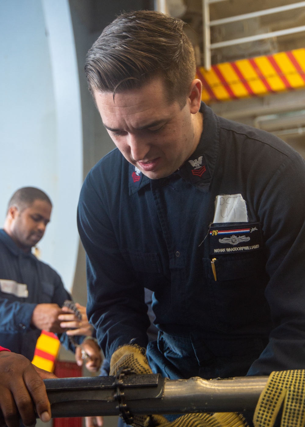 USS Ronald Reagan (CVN 76) Sailors simulate firefighting during general quarters drill
