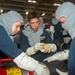 USS Ronald Reagan (CVN 76) Sailors simulate firefighting during general quarters drill
