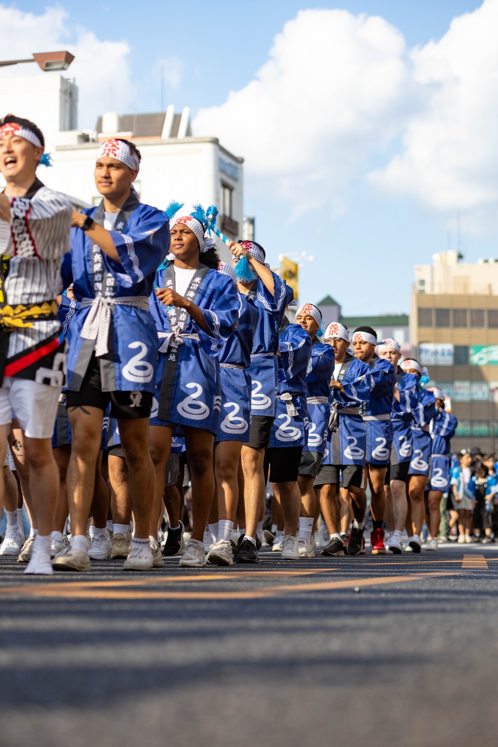 Coming Together - U.S. service members with Marine Corps Air Station Iwakuni participate in Iwakuni Matsuri Festival and Parade