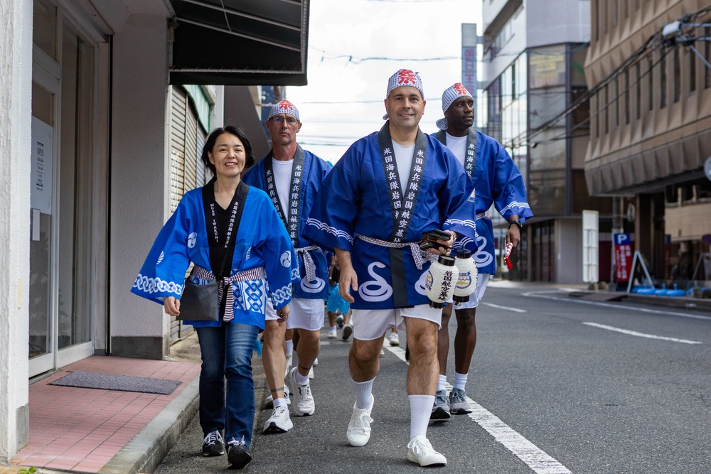 Coming Together - U.S. service members with Marine Corps Air Station Iwakuni participate in Iwakuni Matsuri Festival and Parade