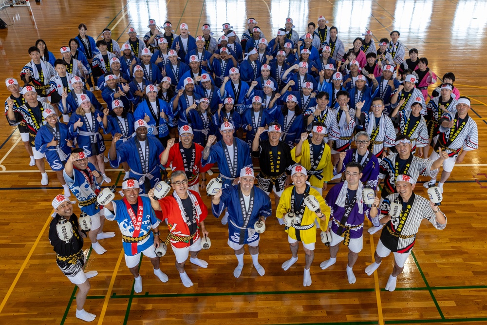 Coming Together - U.S. service members with Marine Corps Air Station Iwakuni participate in Iwakuni Matsuri Festival and Parade