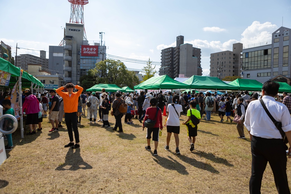 Coming Together - U.S. service members with Marine Corps Air Station Iwakuni participate in Iwakuni Matsuri Festival and Parade