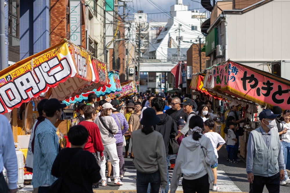 Coming Together - U.S. service members with Marine Corps Air Station Iwakuni participate in Iwakuni Matsuri Festival and Parade