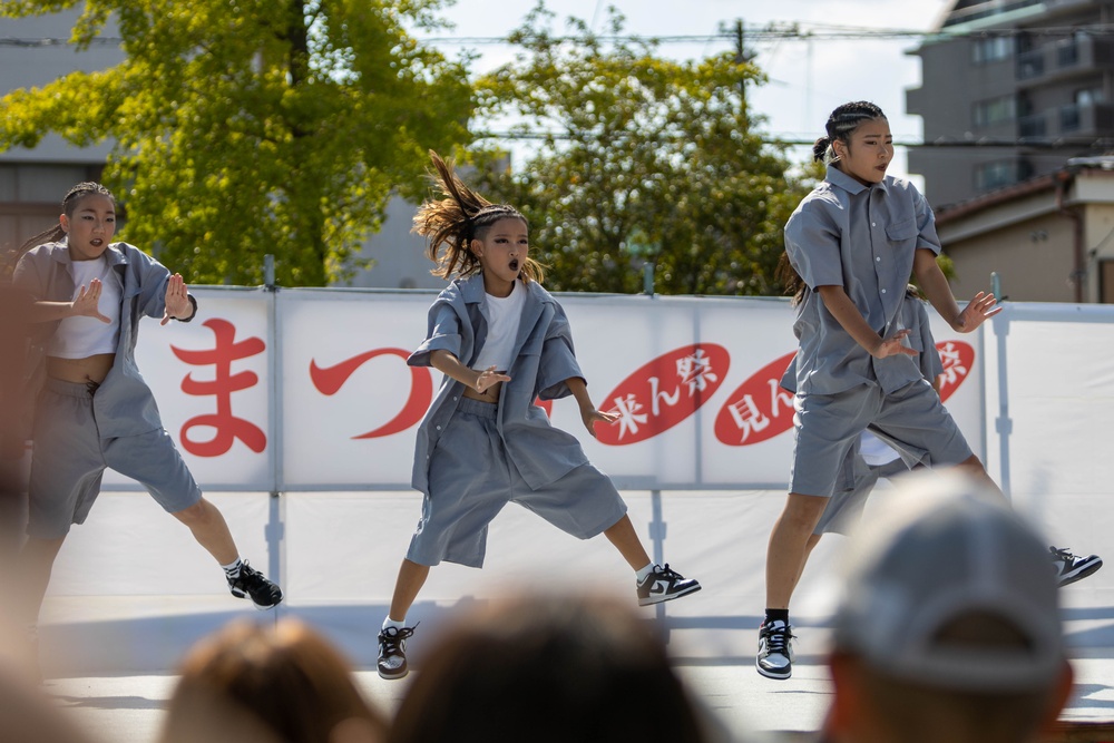 Coming Together - U.S. service members with Marine Corps Air Station Iwakuni participate in Iwakuni Matsuri Festival and Parade