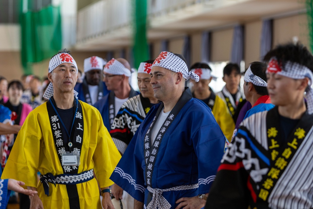 Coming Together - U.S. service members with Marine Corps Air Station Iwakuni participate in Iwakuni Matsuri Festival and Parade