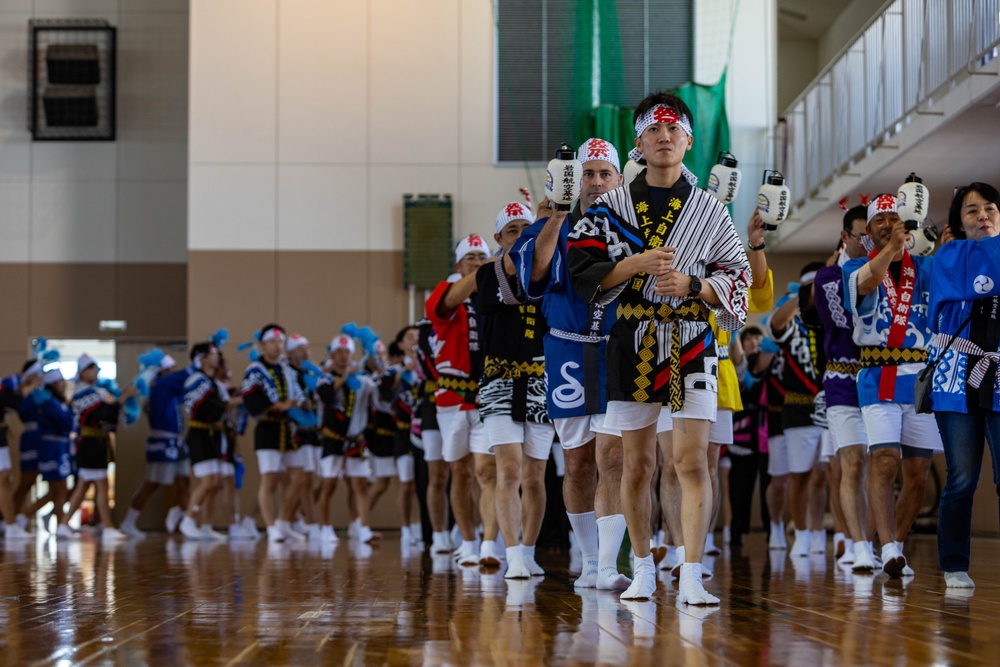 Coming Together - U.S. service members with Marine Corps Air Station Iwakuni participate in Iwakuni Matsuri Festival and Parade