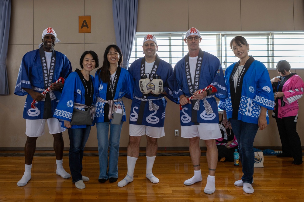 Coming Together - U.S. service members with Marine Corps Air Station Iwakuni participate in Iwakuni Matsuri Festival and Parade