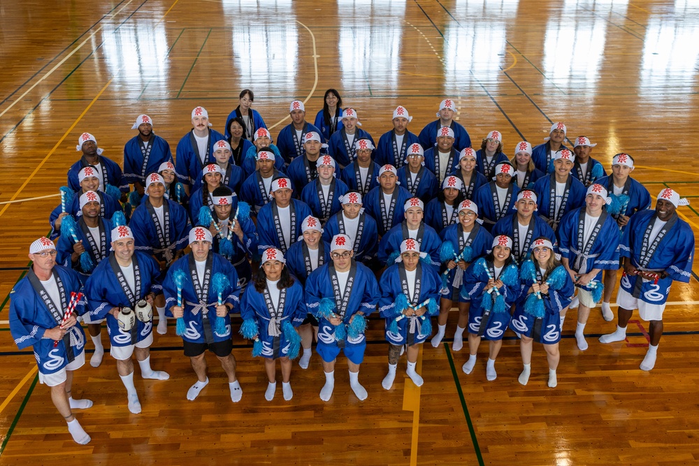 Coming Together - U.S. service members with Marine Corps Air Station Iwakuni participate in Iwakuni Matsuri Festival and Parade