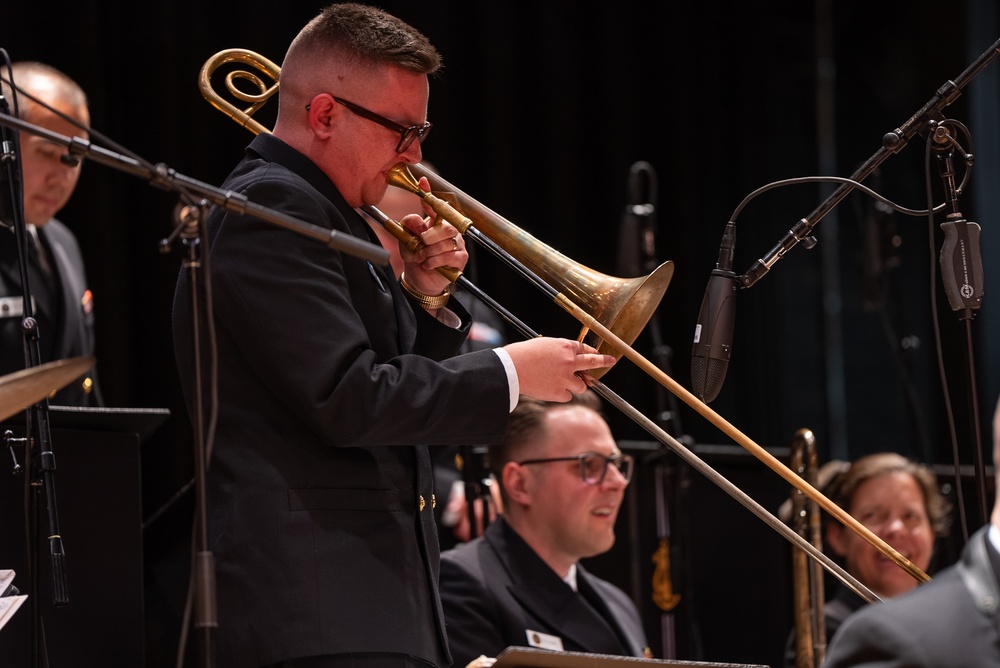 Musician 1st Class David Kapral performs a solo at James Benson Dudley High School