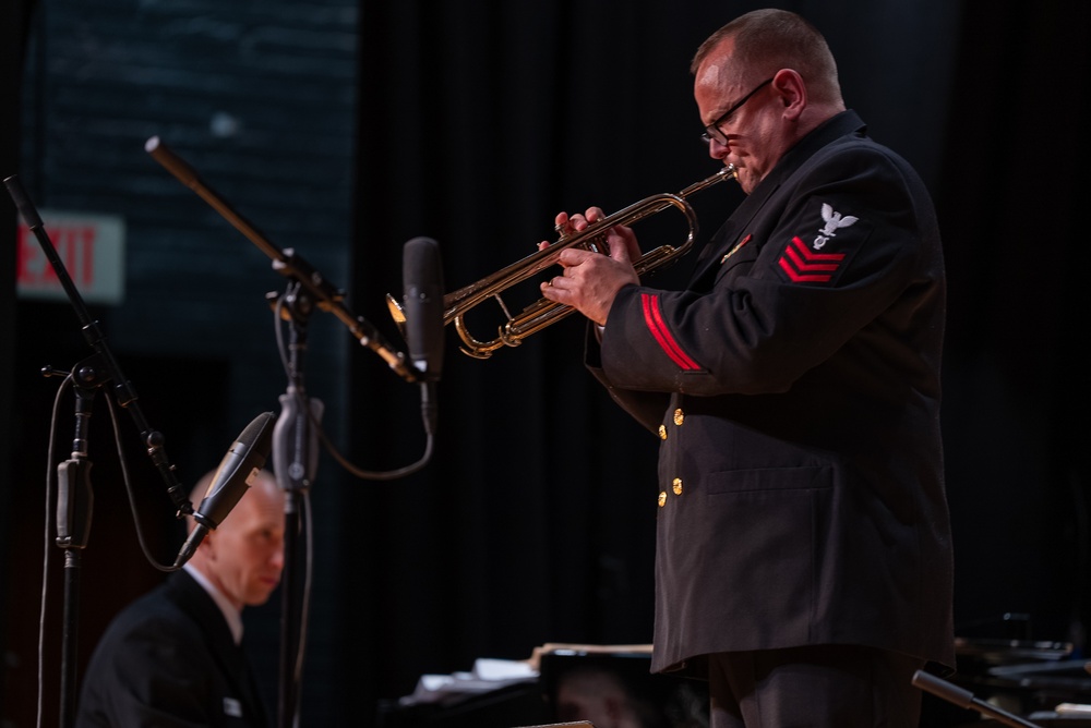 Musician 1st Class Thomas Eby performs a solo at James Benson Dudley High School